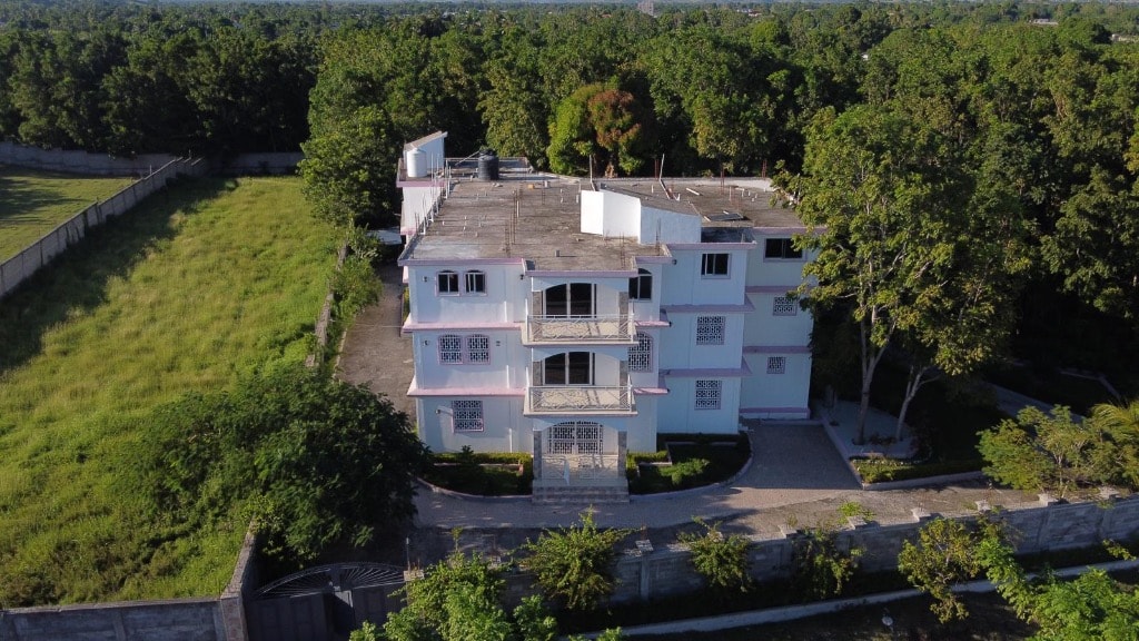Drone aerial view of Villa Rêve Créole surrounded by lush forest